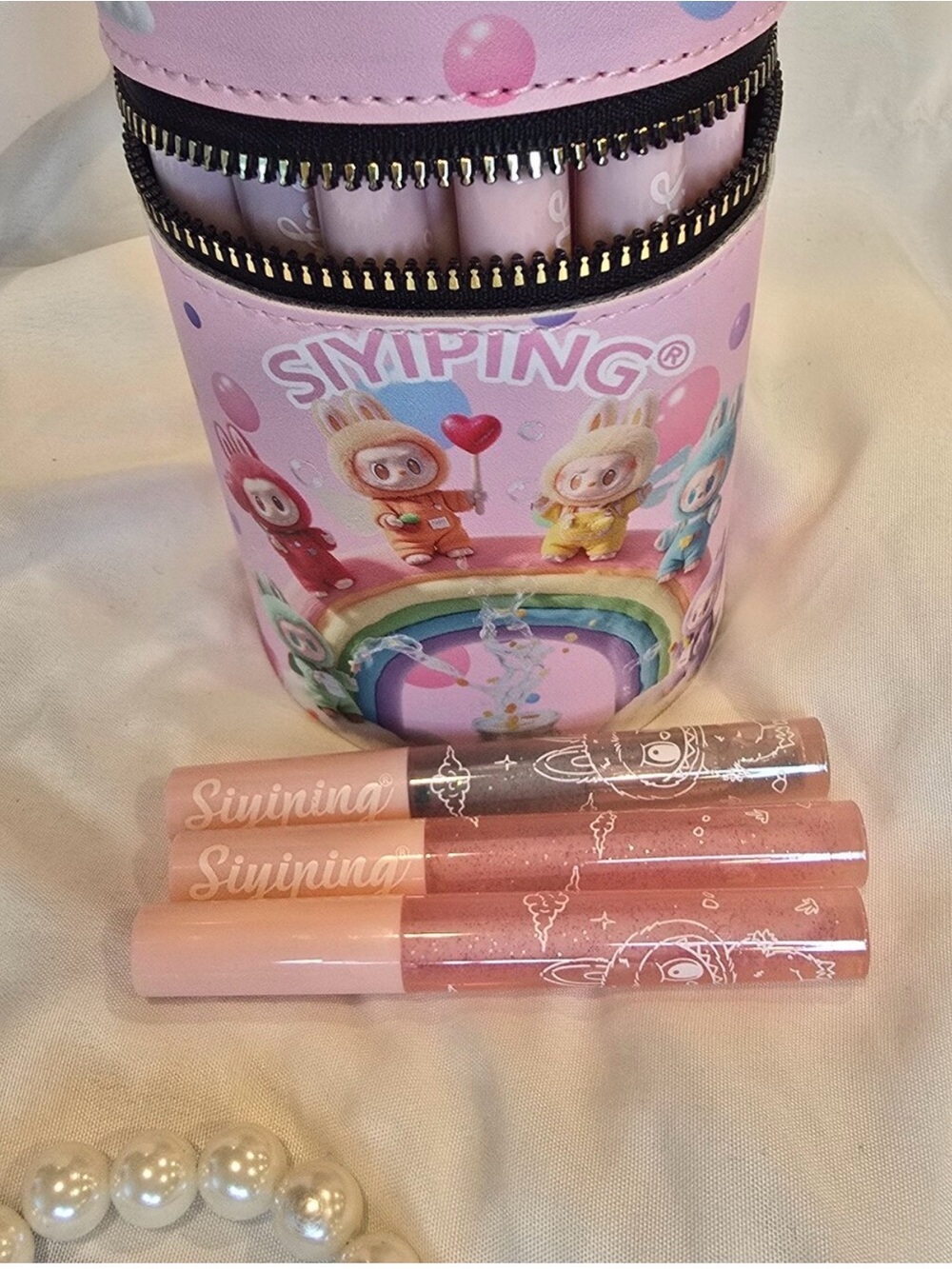 30 lip glosses in a Labubu the themed zippered pouch